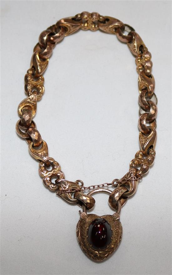 A Victorian gold bracelet with cabochon set clasp.